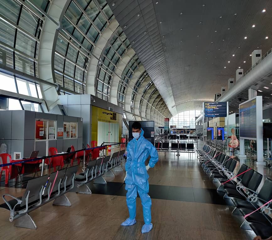 Man in full PPE at airport